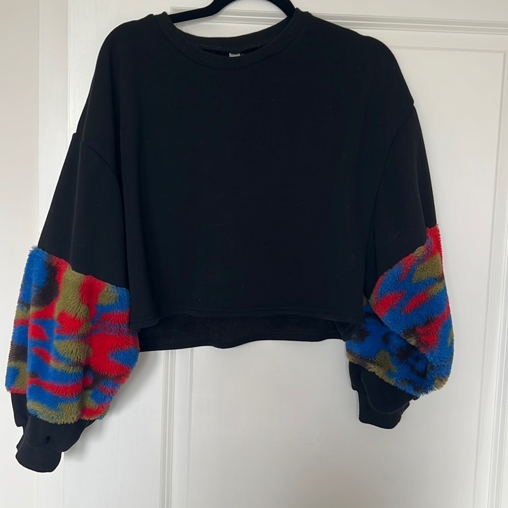 Black sweater with colorful sleeves